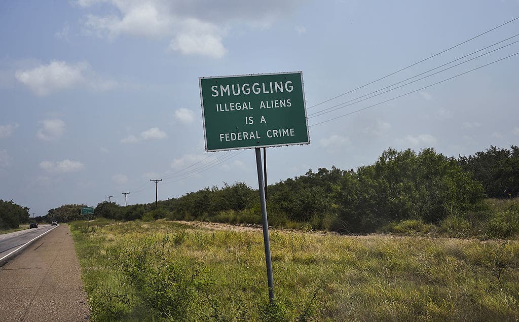 Oklahoma trucker charged after 42 migrants found locked in hot tractor-trailer at Texas checkpoint