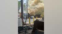 Firefighters battling container fire in Conroe