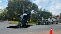 Pickup truck swallowed by road collapse following major water main break in Beaumont