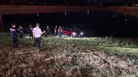 Driver rescued from retention pond in Spring after missing curve