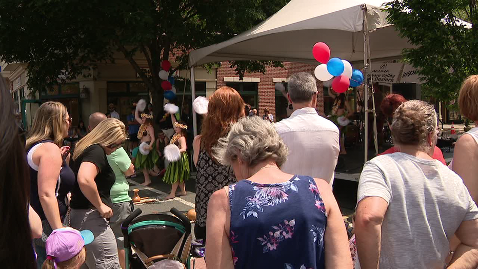 Folks enjoying Hawaiian music at the Collingswood May Fair.