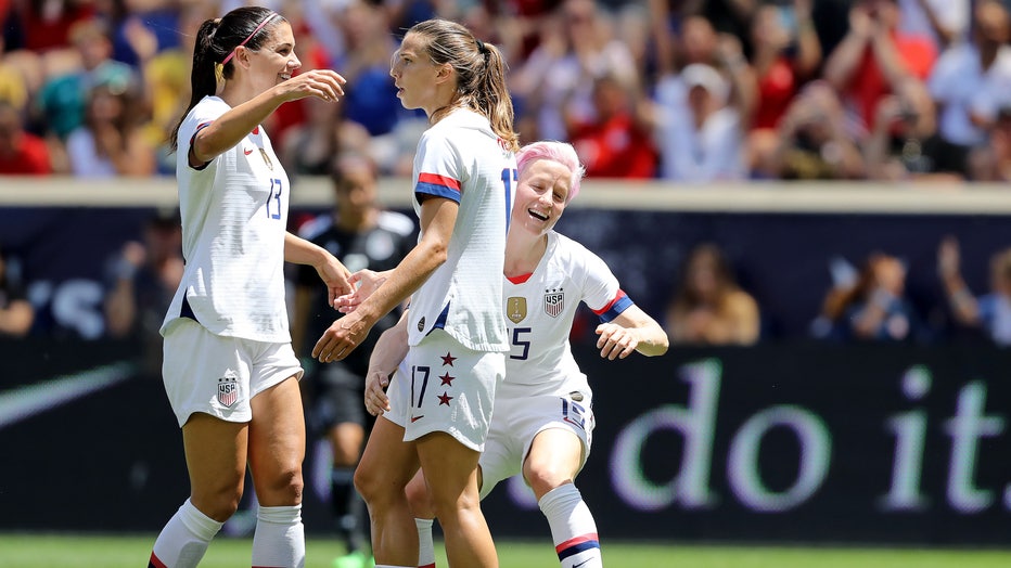 Tobin Heath #17 of the United States is congratulated by teammates Megan Rapinoe #15 and Alex Morgan #13 after she scored in the first half against Mexico at Red Bull Arena on May 26, 2019 in Harrison, New Jersey.