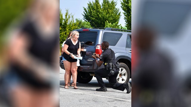 'Surprise of her life': Police officer pulls girlfriend over in traffic stop to propose