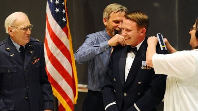 World War II vet, 101, commissions grandson during Air Force Academy graduation