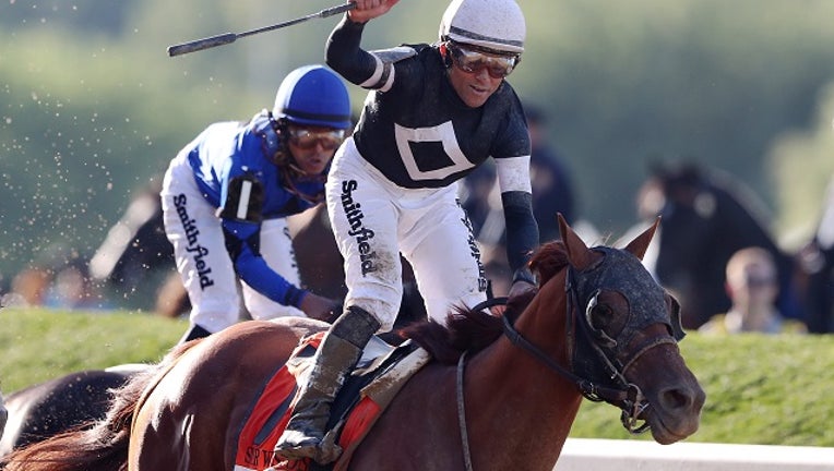 Sir Winston with Joel Rosario celebrates after winning the Belmont Stakes. (Photo by Mike Stobe/Getty Images)