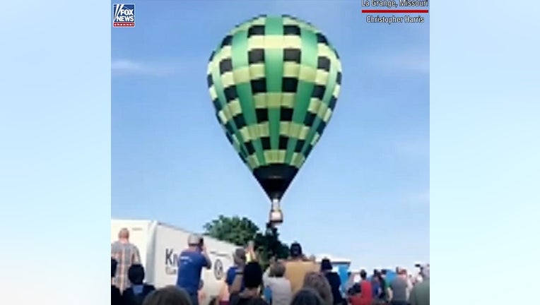 At least one person was hurt after an out-of-control hot air balloon ripped through a crowded festival in Missouri.