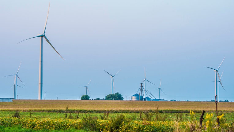 Wind turbines on the Bishop Hill wind farm operate among the corn and soybean fields near Bishop Hill, Ill., Sept. 14, 2017. USDA Photo by Preston Keres