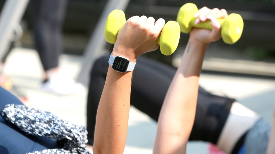 Women participate in a workout.