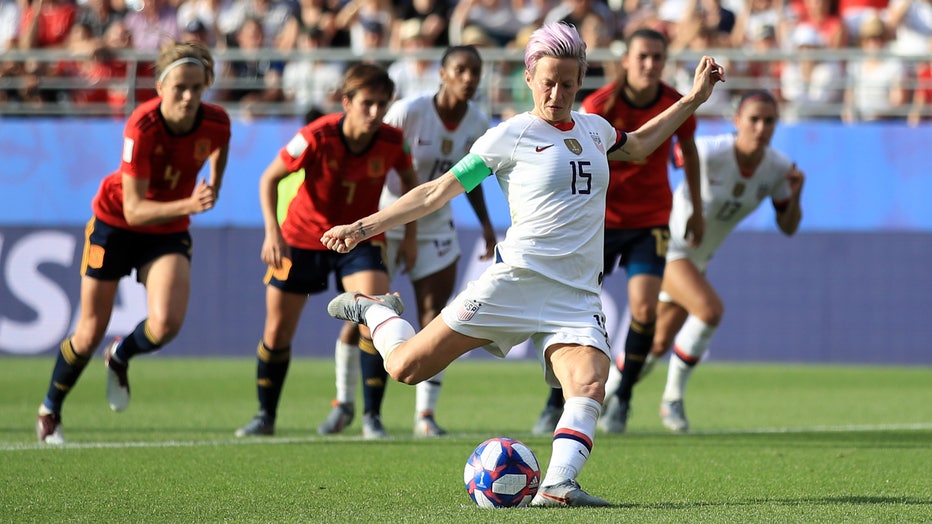 Megan Rapinoe of the USA scores her team's second goal from the penalty spot during the 2019 FIFA Women's World Cup France Round Of 16 match between Spain and USA on June 24, 2019 in Reims, France. (Photo by Marc Atkins/Getty Images)