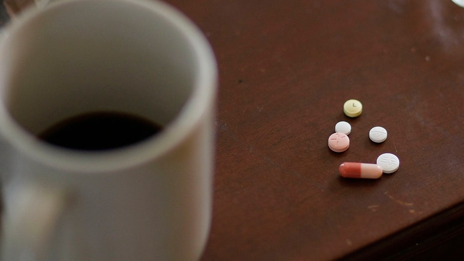 Prescription pills are shown on a table in this 2009 file image. (Photo by Joe Raedle/Getty Images)