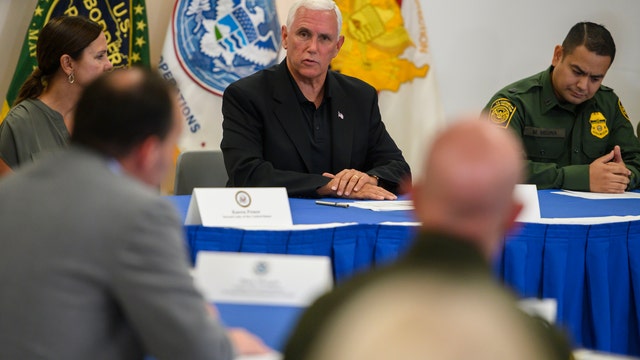 Pence tour of migrant center shows men crowded in cages