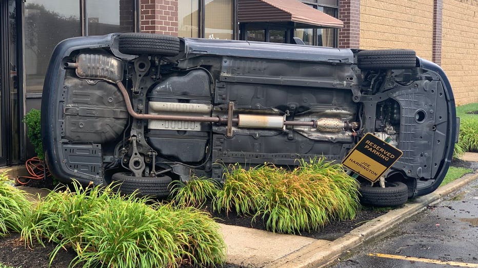 A vehicle was reportedly overturned into a business due to severe weather Saturday.
