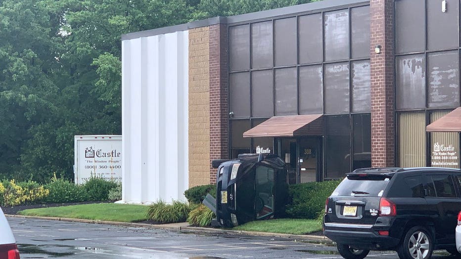 Vehicle reportedly overturned by severe weather into a business in Mount Laurel, N.J.
