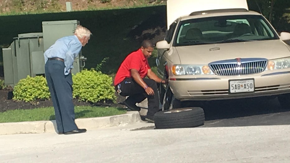 Chick-Fil-A manager Daryl Howard is seen coming to the aid of a 96-year-old man with a flat tire outside of a restaurant in Severn, Maryland. (Photo credit: Rudy Somoza)