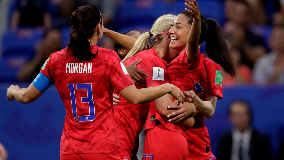 Alex Morgan, Lindsey Horan and Christen Press celebrate during the World Cup Women match between England v USA at the Stade de Lyon on July 2, 2019 in Lyon France (Photo by Eric Verhoeven/Soccrates/Getty Images)