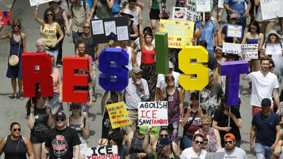 The protesters at Saturday's march belted chants critical of President Donald Trump and the Immigration and Customs Enforcement agency.