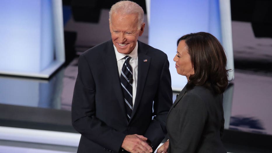 Former Vice President Joe Biden smiles as he shakes hands with Sen. Kamala Harris during the opening of night two of the second set of Democratic debates in Detroit, Michigan, on July 31, 2019.