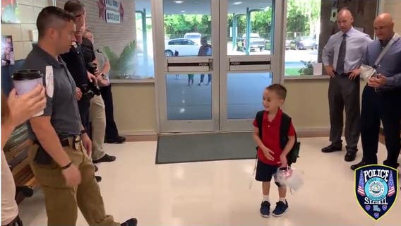 Son of fallen officer receives warm welcome from police on first day of kindergarten