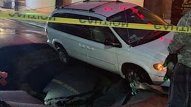 Large sinkhole opens in Delaware County parking lot after flooding