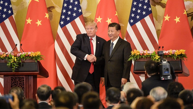 US President Donald Trump (L) shakes hands with China's President Xi Jinping at the end of a press conference at the Great Hall of the People in Beijing on November 9, 2017.
Donald Trump and Xi Jinping put their professed friendship to the test on November 9 as the least popular US president in decades and the newly empowered Chinese leader met for tough talks on trade and North Korea. / AFP PHOTO / Fred DUFOUR (Photo credit should read FRED DUFOUR/AFP/Getty Images)