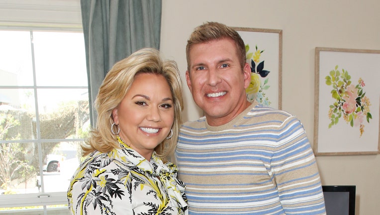 UNIVERSAL CITY, CA - JUNE 18: Reality TV Personalities Julie Chrisley (L) and Todd Chrisley (R) visit Hallmark's 
