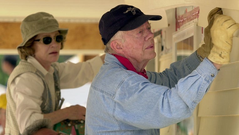 Former President Jimmy Carter and his wife Rosalynn at Habitat for Humanity event.