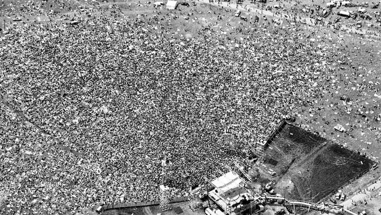 An aerial view of the crowd and stage at the Woodstock Music and Art Fair in White Lake, New York on August 17, 1969. 