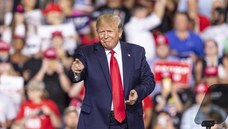 U.S. President Donald Trump speaks during campaign MAGA rally at Southern New Hampshire University Arena.