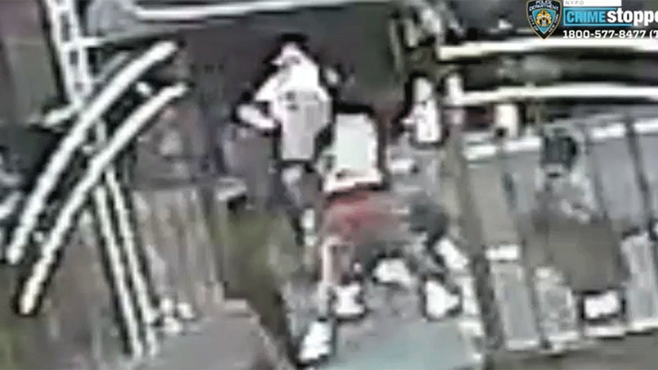 Four thugs pushed a 67-year-old woman who was walking with a cane to the ground, beat her with it and then took off with her cell phone. (NYPD)