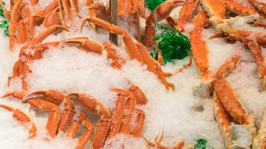 FILE - Crab legs on display at a grocery store.