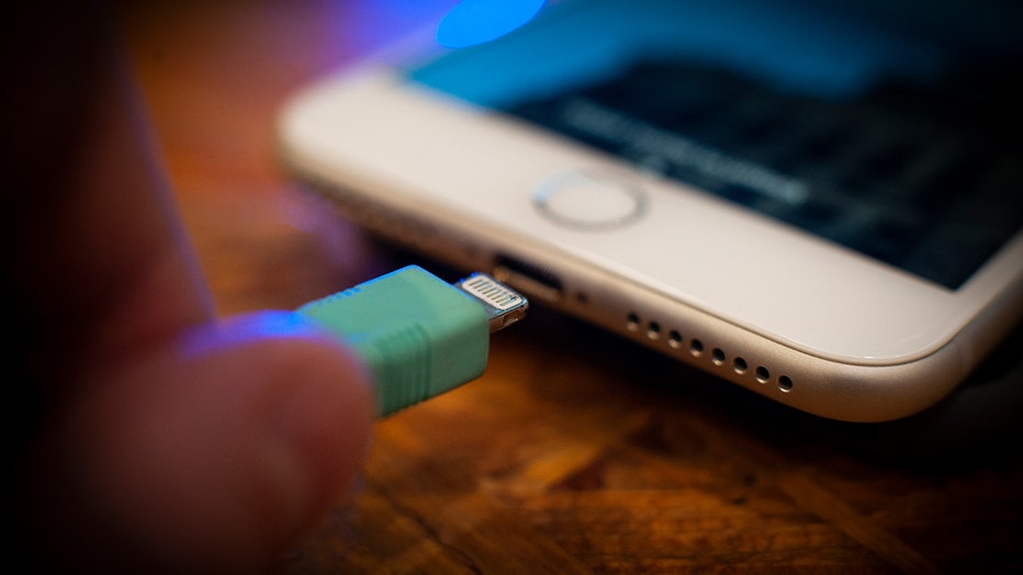 FILE - A lightning cable for powering Apple iPhones and iPads.