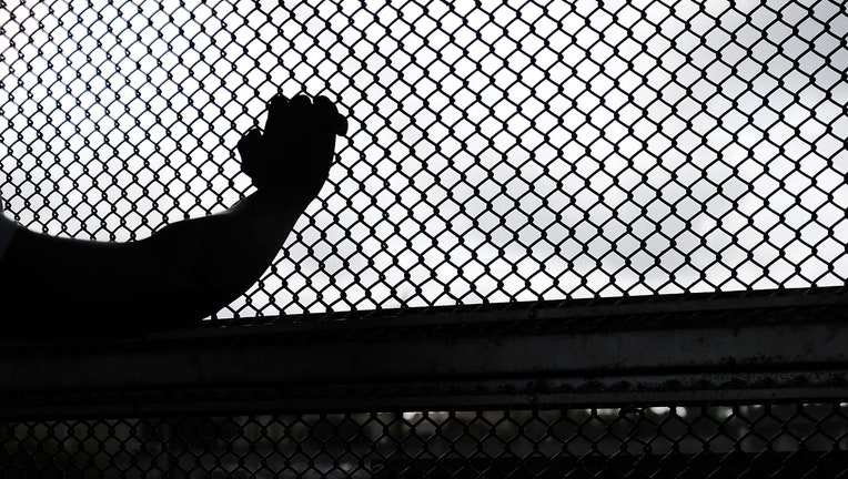 BROWNSVILLE, TX - JUNE 22: A Cuban man seeking asylum waits along the border bridge after being denied into the Texas city of Brownsville which has become dependent on the daily crossing into and out of Mexico on June 22, 2018 in Brownsville, Texas. Immigration has once again been put in the spotlight as Democrats and Republicans spar over the detention of children and families seeking asylum at the border. Before President Donald Trump signed an executive order Wednesday that halts the practice of separating families who were seeking asylum, over 2,300 immigrant children had been separated from their parents in the zero-tolerance policy for border crossers. (Photo by Spencer Platt/Getty Images)