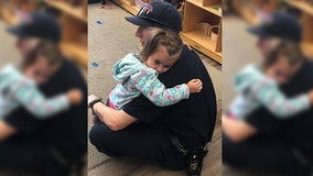 Viral photo shows firefighter comforting preschooler recently diagnosed with autism