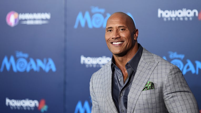 FILE - Dwayne Johnson and his family have tested positive for COVID-19. Johnson is seen at the AFI FEST 2016 Presented By Audi premiere of Disney's
