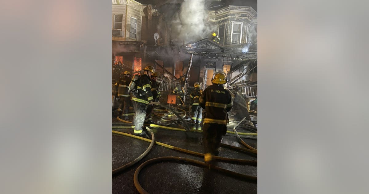 Families displaced after fire spreads to multiple row homes in North ...