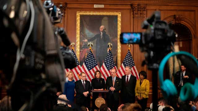 Pelosi leads 'somber' Trump impeachment