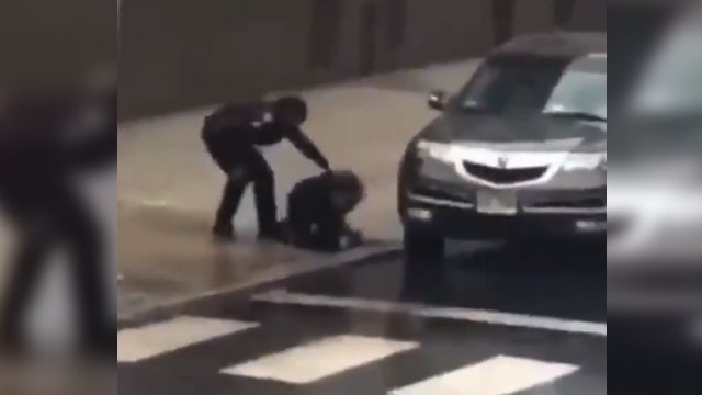 Harrowing video shows Jersey City officer running into gunfire to rescue fellow officer