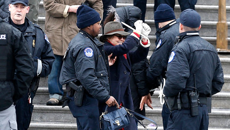 WASHINGTON, DC - DECEMBER 13: Sally Field is arrested during 