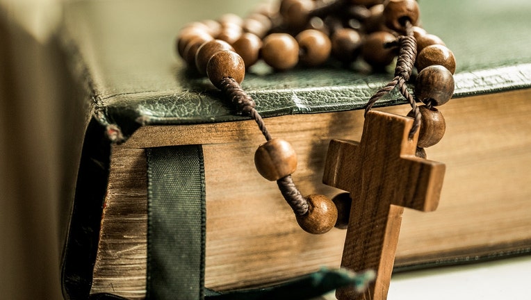 Bible with prayer beads