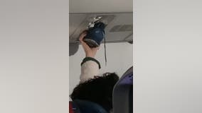 Video: Passengers say nothing as person uses airplane vent to dry shoe