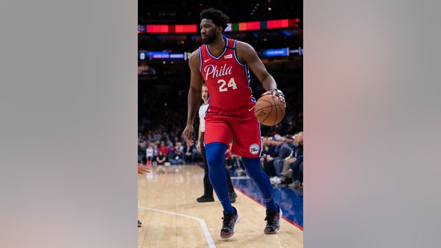 Embiid scores 24 in uniform No. 24 for Bryant in 76ers' win