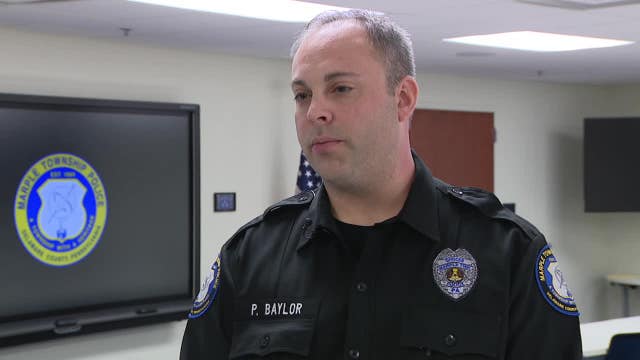 Police officer, off-duty firefighter run into burning home to save woman