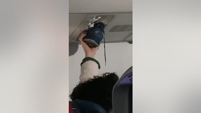 Video: Passengers say nothing as person uses airplane vent to dry shoe