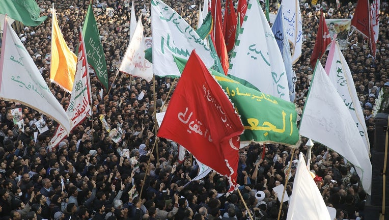 Iranians march in the streets of Ahvaz to pay homage to top general Qasem Soleimani.