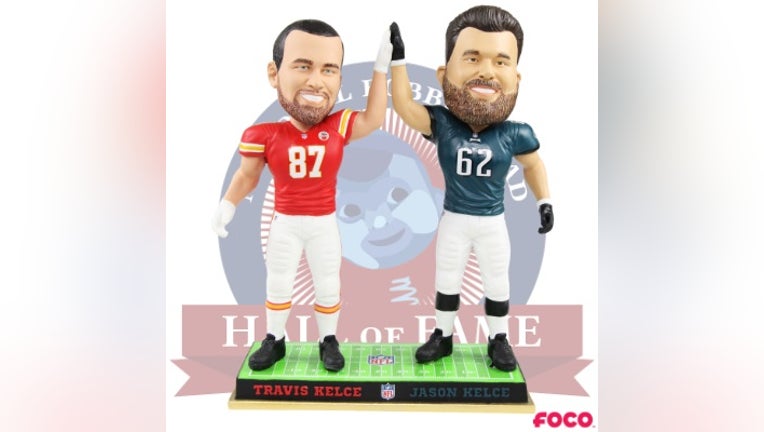 Kansas City Chiefs tight end Travis Kelce and Philadelphia Eagles center Jason Kelce appear in bobblehead form.