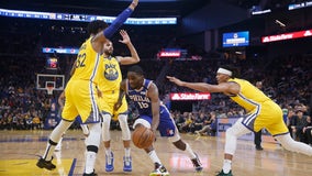 Curry-less Warriors rally to beat 76ers 118-114