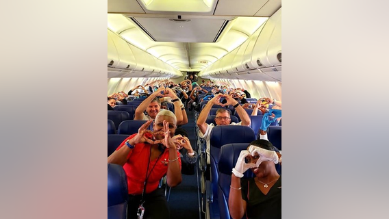 Viral photos show health care workers on plane, en route to New York to help in coronavirus fight