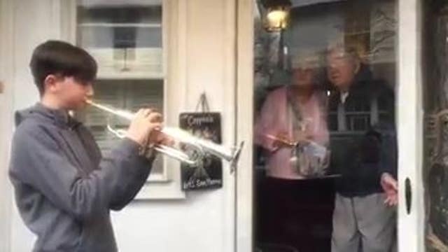 Local teen performs trumpet solo for elderly couple while practicing social distancing