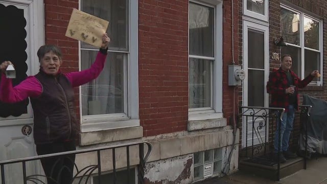 South Philadelphia residents ring bells applauding healthcare, food service workers