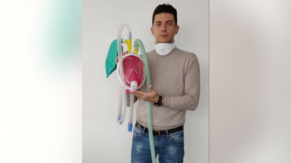 Isinnova CEO Cristian Fracassi holding the innovative CPAP mask.